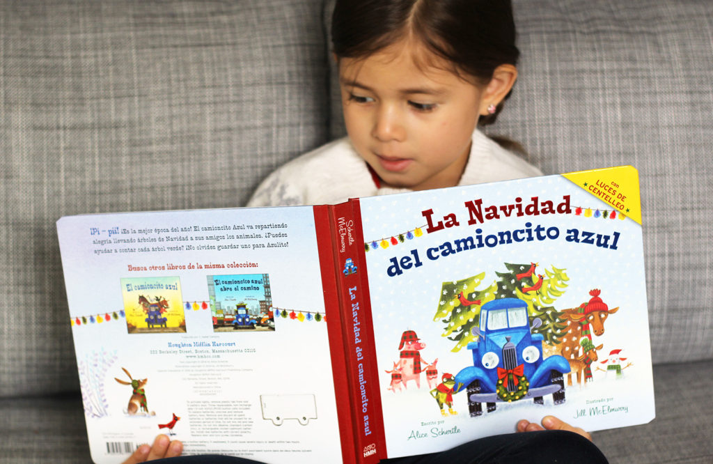 toddler reading Spanish Christmas book