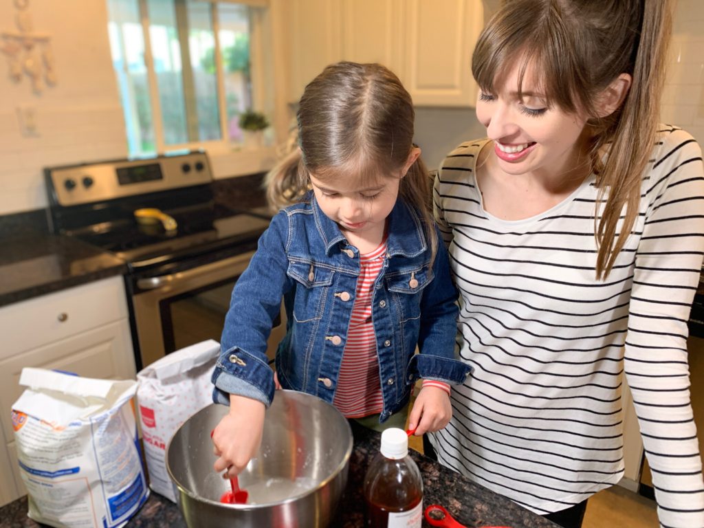 Woman and girl making brownies