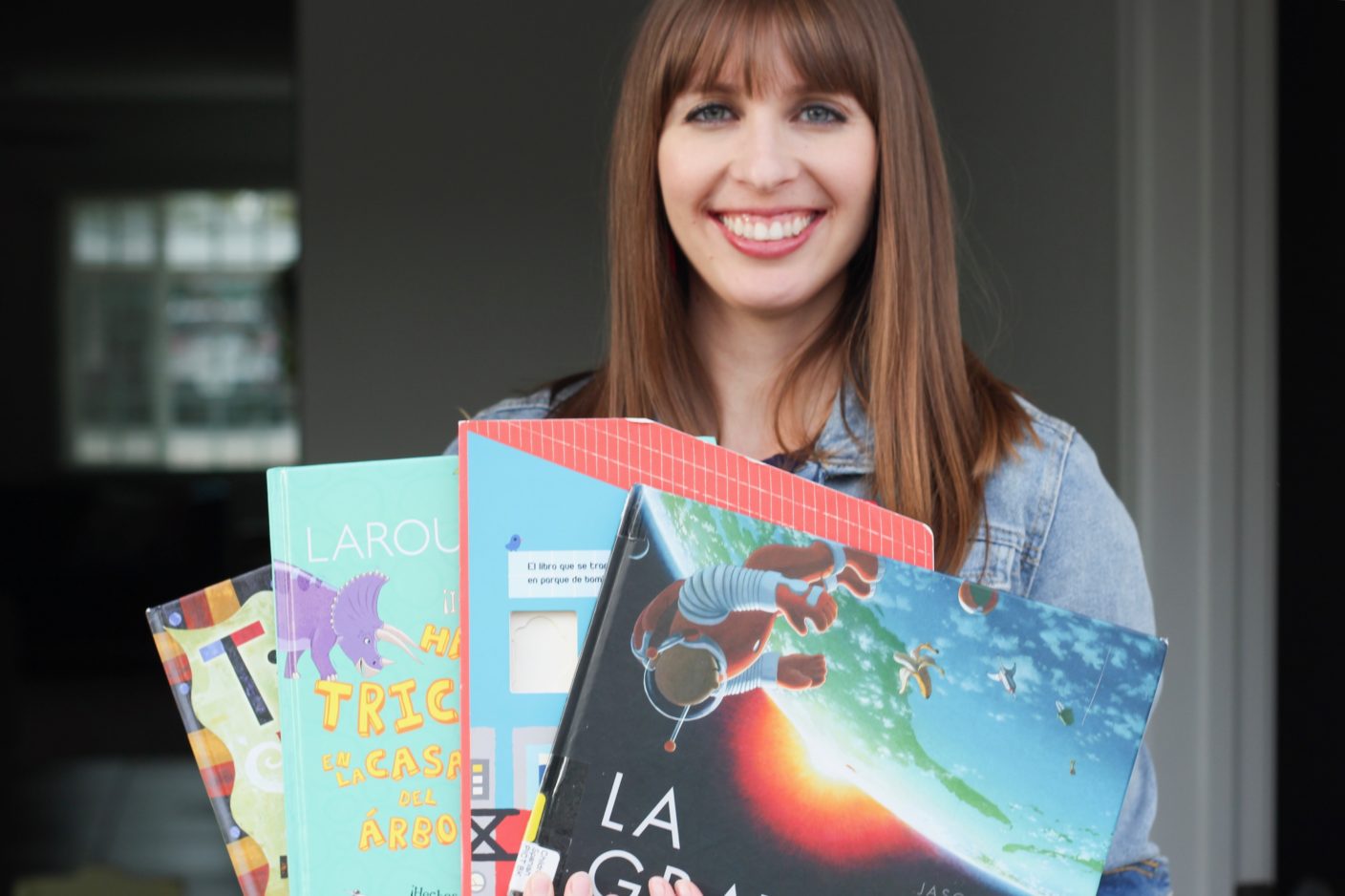 Mom holding nonfiction picture books